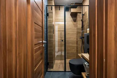 a bathroom with a toilet and a glass shower at Lux Flat next to Park with working space by Flat Mаnager in Sofia