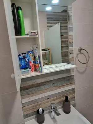 a bathroom with a sink and a mirror at Apartment KALINA with free private parking in Plovdiv