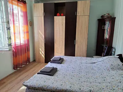 a bedroom with a bed with two towels on it at Zoev in Plovdiv