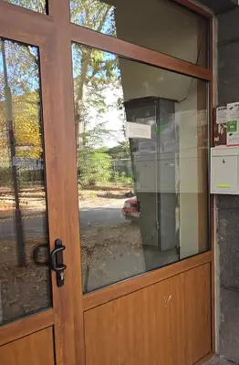 a front door with a glass window on a building at Zoev in Plovdiv