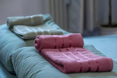 a couple of towels sitting on top of a couch at Two Homelike Apartments by NDK and Vitosha Blvd with 2 Free Parking Spots in Sofia