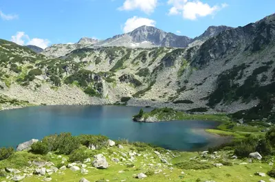 a mountain lake in the middle of a valley at 