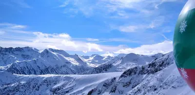 a view of a snowy mountain range from an airplane at apartment Mountain Delight, Bansko in Bansko