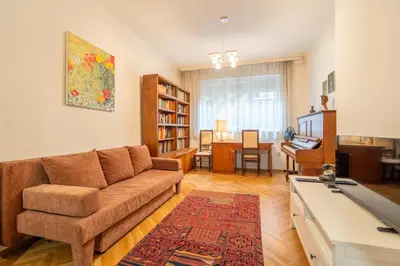 a living room with a couch and a table at Opera in Sofia