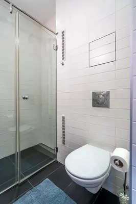 a bathroom with a toilet and a shower at Opera in Sofia