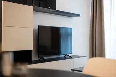 a flat screen tv sitting on top of a white cabinet at Central View Apartment 1 in Blagoevgrad