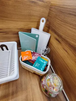 a table with a plastic container on a table at The Modern Suite Life with Terrace in Sofia