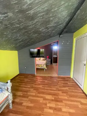 a room with a couch and a tv on a ceiling at Вила Маца in Sapareva Banya