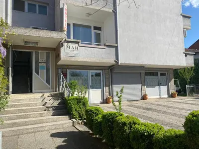 a house with a staircase leading to the front door at Family Hotel 