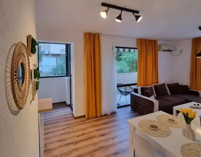 a living room with a couch and a table at Apartament G&M in Sandanski