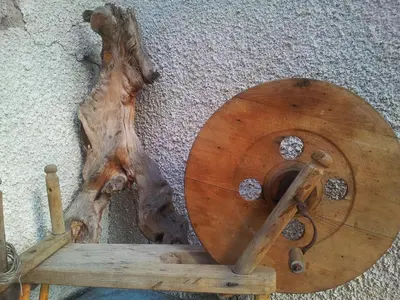 a wooden bowl on the ground next to a tree stump at СПА къща за гости Каза Роза - Swiss Style Chalet Casa Rosa SPA Guest House in Kyustendil