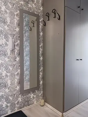a bathroom with a mirror and a sink at Тристаен апартамент in Sofia