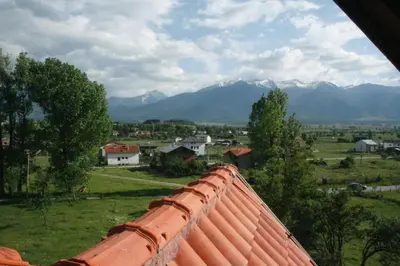 a view from the roof of a house with mountains at Villa Detelina near the Bansko Ski Resort in Razlog