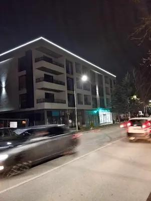 a car driving down a street in front of a building at Апартамент за гости Боляри 2 in Velingrad