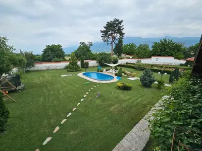a large yard with a swimming pool in it at Vila Teo in Vasil Levski