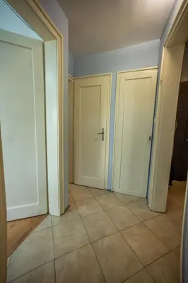an empty room with two doors and a tile floor at 3-BR Central Residence in Sofia