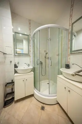a bathroom with a shower and a sink at 3-BR Central Residence in Sofia