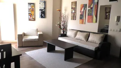 a living room with a couch and a table at Bansko Ski Apartments in Bansko Royal Towers in Bansko