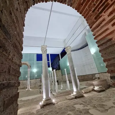 a group of columns in a room with a brick wall at Apart 8 in Sandanski