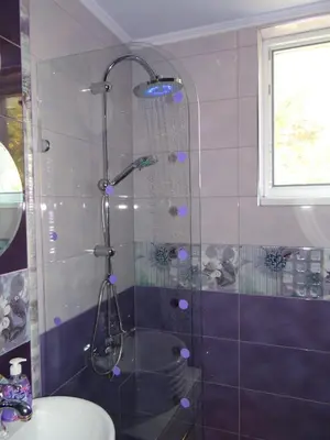 a bathroom with a shower with a toilet and a sink at Orange Flower Apartments 1 in Sofia