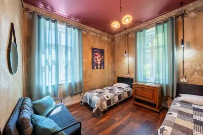 a living room with a bed and a couch at Guesthouse32 in Sofia
