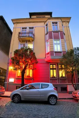 a silver car parked in front of a building at Guesthouse32 in Sofia