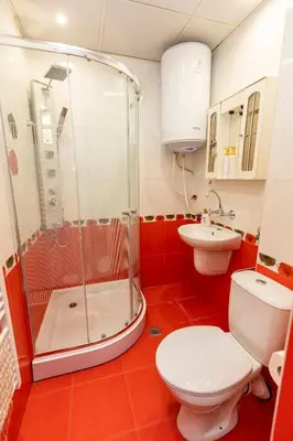 a bathroom with a shower and a toilet and a sink at Апартамент “Djanina 2” in Sandanski