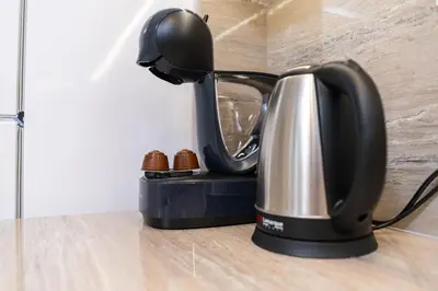 a coffee maker is sitting on the floor at Stylish One-Bedroom Apartment in Plovdiv
