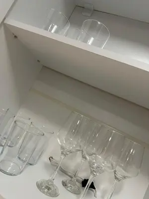 a row of wine glasses sitting on a shelf at CENTER Elegant Living in Sofia