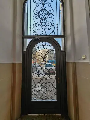 a black door with a window in a building at Central 1-BR Apartment in Sofia