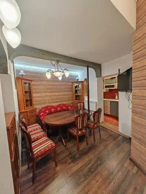 a kitchen and dining room with a table and chairs at Central 1-BR Apartment in Sofia