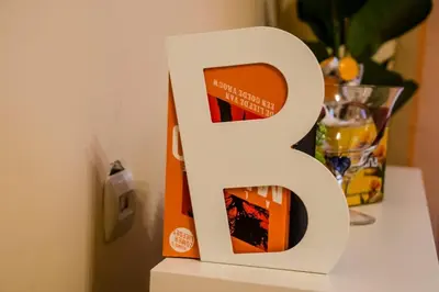 a white letter b sitting on top of a table at 23 Central 1 Bedroom Apartment with Balcony in Sofia