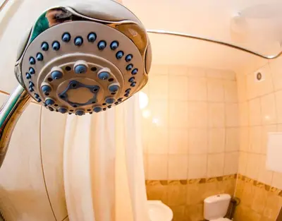 a shower curtain in a bathroom with a shower at 23 Central 1 Bedroom Apartment with Balcony in Sofia