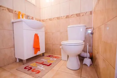 a bathroom with a toilet and a sink at 35 Cozy Central 1 Bedroom Apartment with Balcony in Sofia