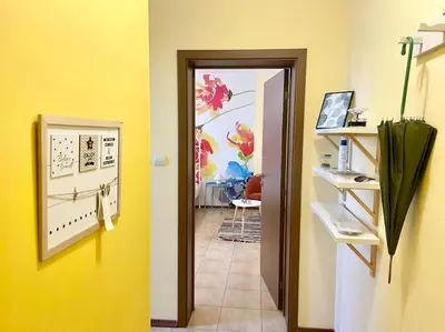 a hallway with a door leading to a room at 35 Cozy Central 1 Bedroom Apartment with Balcony in Sofia