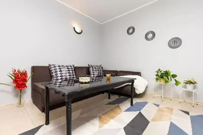 a living room with a couch and a table at Central apt 'SELIN' Walking distance to center in Plovdiv