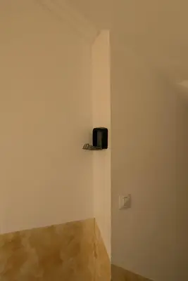 a room with a small black object on the wall at 2-Bedroom Flat - Sunny Balcony in Plovdiv