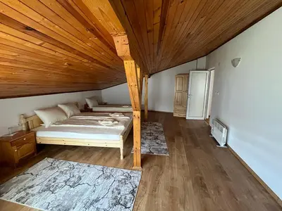 a bedroom with a bed and a wooden ceiling at ЕДЕЛВАЙС Сърница in Sarnitsa