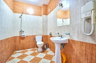 a bathroom with a toilet and a sink at Вълеви Къщи in Chiflik