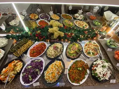 a table with many plates of food on it at Hotel Zara in Bansko