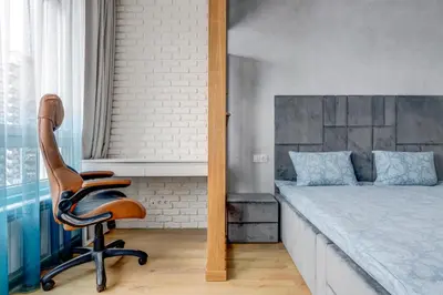 a bedroom with a bed and a chair in it at Luxury 2 BDRM Getaway and Free Parking in Sofia