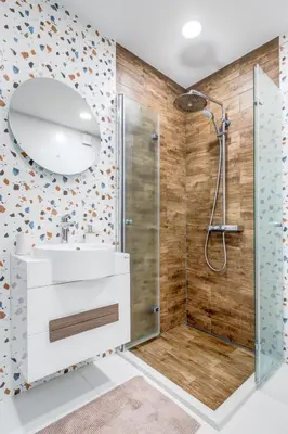 a bathroom with a shower and a sink and a mirror at Luxury 2 BDRM Getaway and Free Parking in Sofia