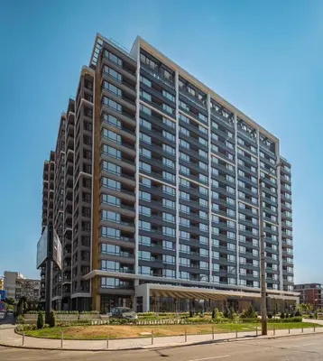 a large apartment building on a city street at Luxury 2 BDRM Getaway and Free Parking in Sofia