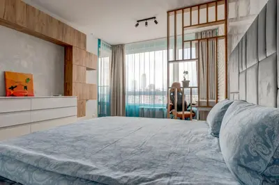 a bedroom with a large bed and a desk at Luxury 2 BDRM Getaway and Free Parking in Sofia