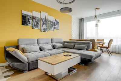 a living room with a couch and a table at Luxury 2 BDRM Getaway and Free Parking in Sofia