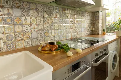 a kitchen with a sink and a counter top at ArtE Vitosha Blvd in Sofia