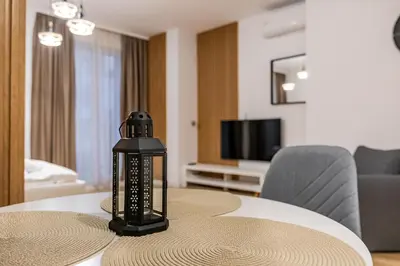 a black lantern sitting on top of a table at Stylish Studio with Free Parking in Sofia