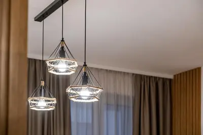 a group of lights hanging from a ceiling at Stylish Studio with Free Parking in Sofia
