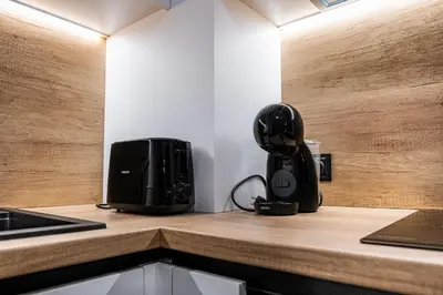 a black appliance sitting on a counter in a kitchen at Stylish Studio with Free Parking in Sofia