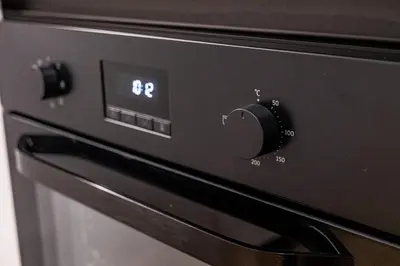 a close up of an oven with a clock on it at Stylish Studio with Free Parking in Sofia